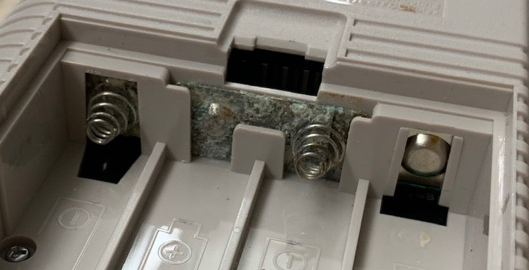 Corrosion cleanup - battery contacts - hand-held-legend